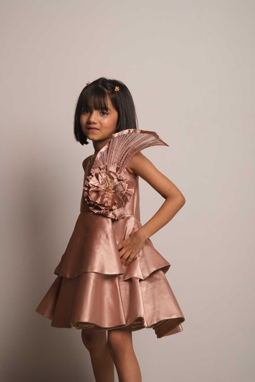 Girls' Rose Gold Satin Party Dress with Layered Hem & Statement Shoulder Detail