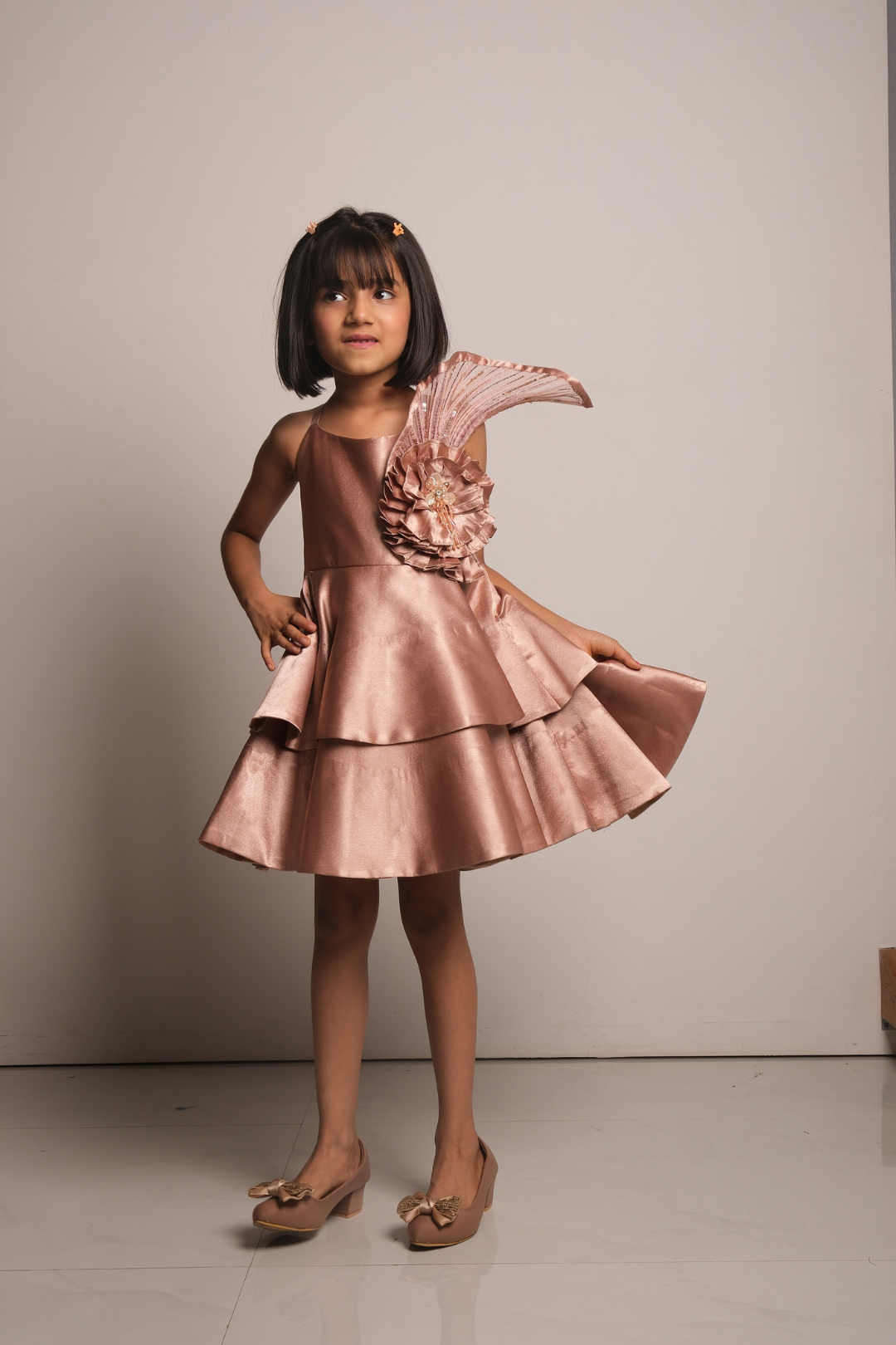 Girls' Rose Gold Satin Party Dress with Layered Hem & Statement Shoulder Detail