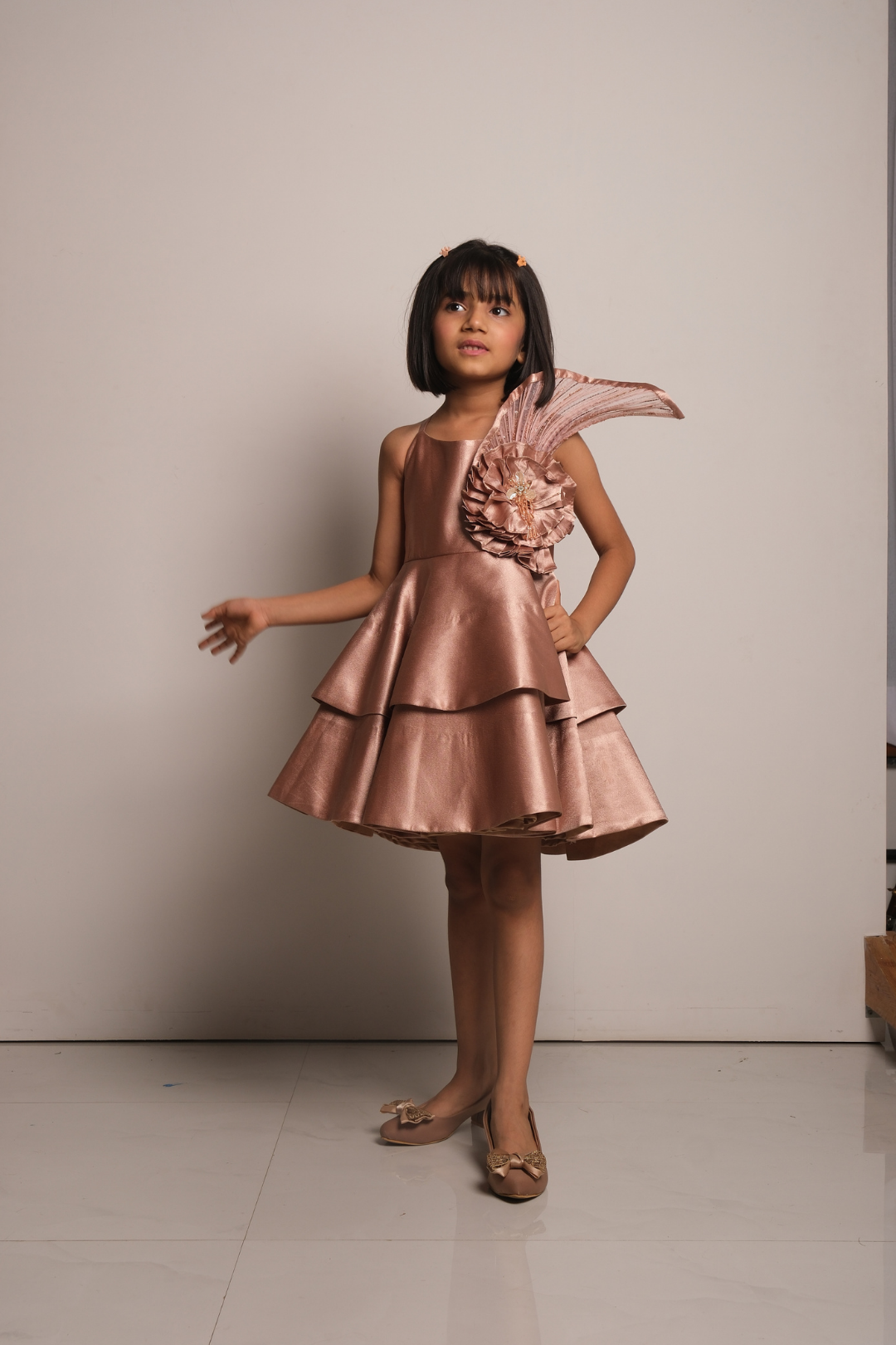 Girls' Rose Gold Satin Party Dress with Layered Hem & Statement Shoulder Detail